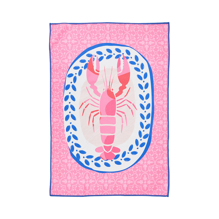 Pink tea towel with a lobster design on a white background