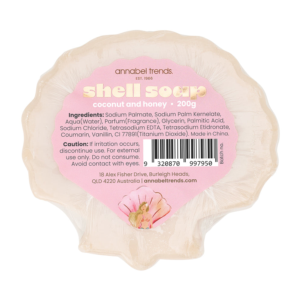 Shell-shaped soap with a pink label displaying product details on a white background