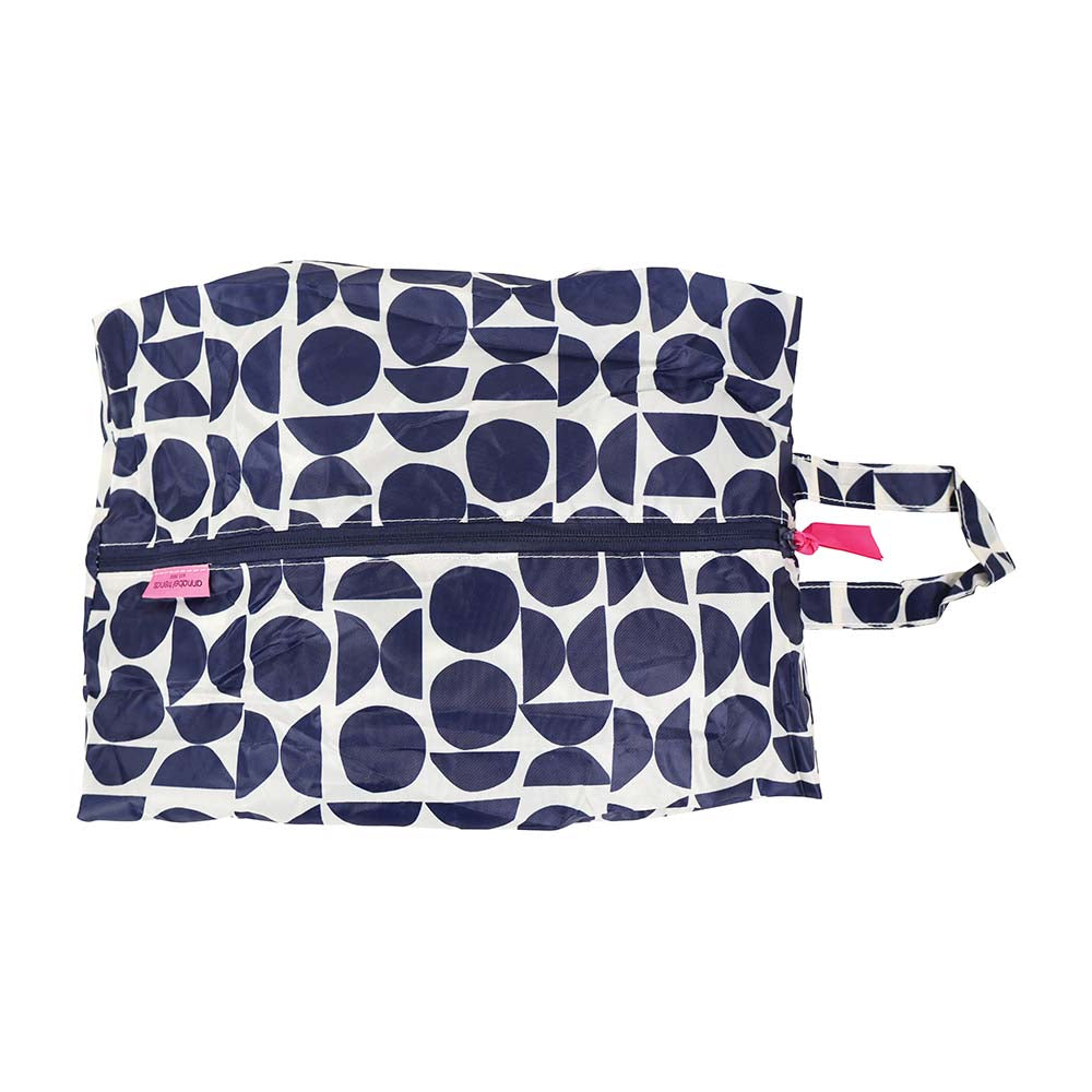 Navy blue and white patterned shoe bag with a pink tag on a white background