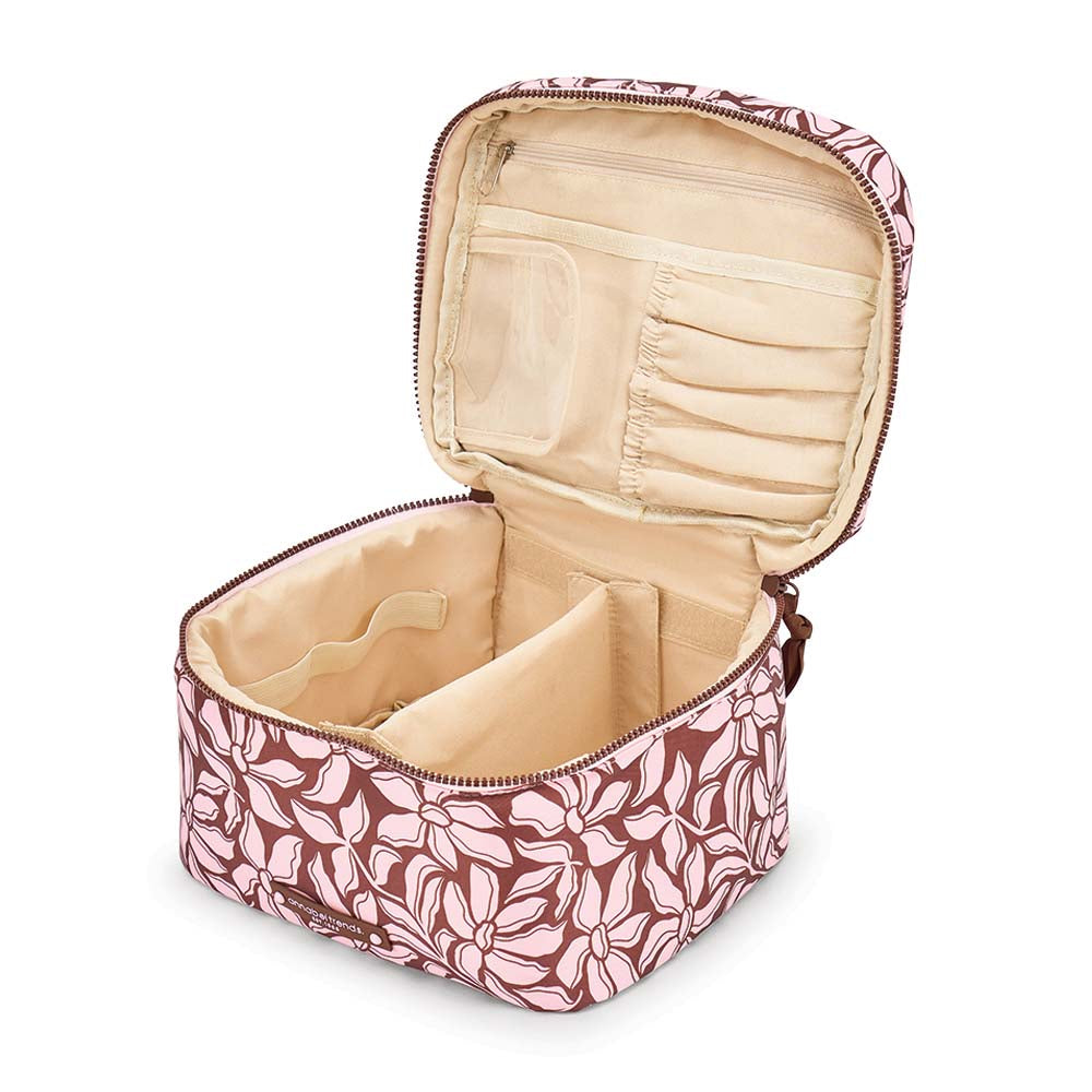 Pink floral-patterned makeup bag with open interior on a white background