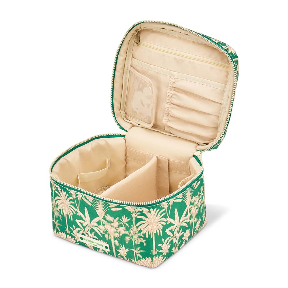 Green and beige floral-patterned jewelry box with open lid on a white background