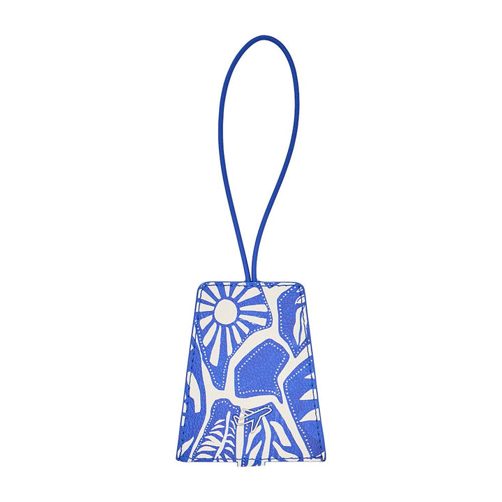 Blue and white patterned luggage tag on a white background