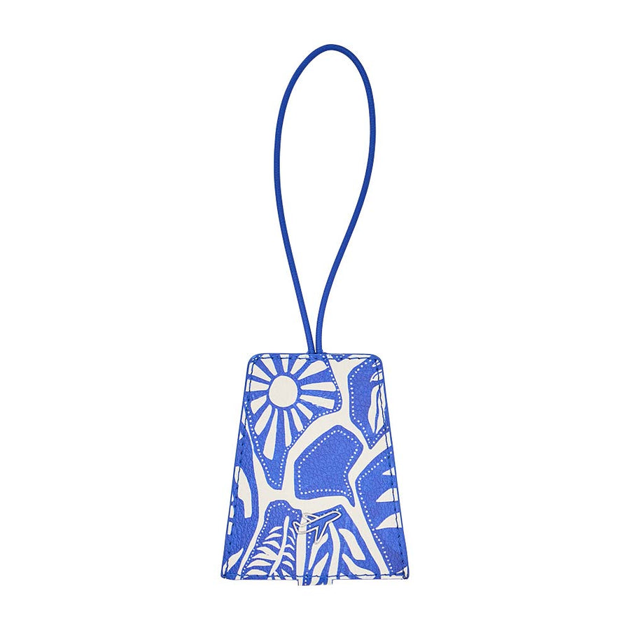 Blue and white patterned luggage tag on a white background