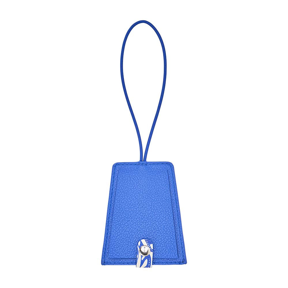 Blue luggage tag with a strap on a white background