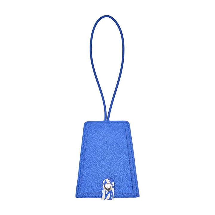 Blue luggage tag with a strap on a white background