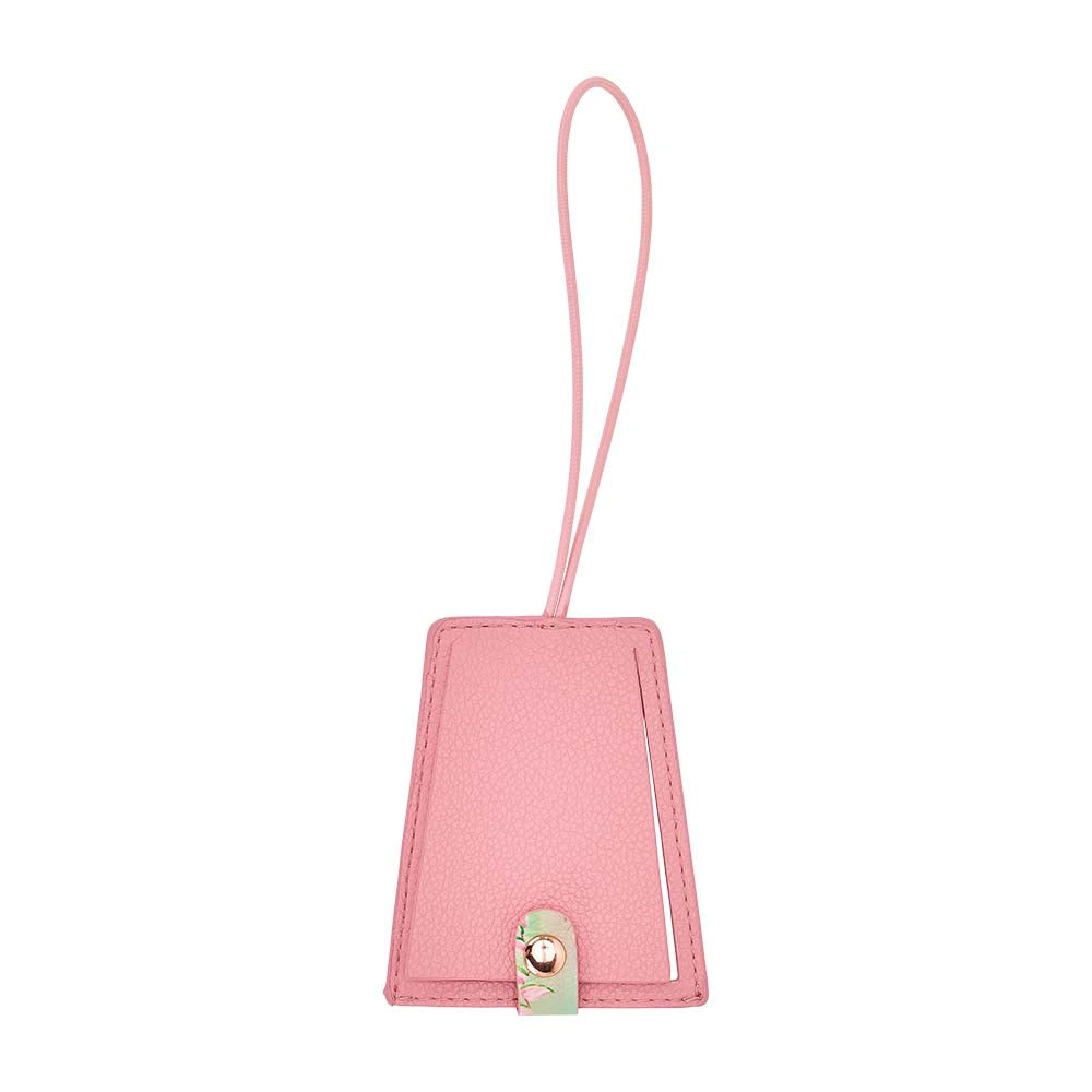 Pink luggage tag with a strap on a white background