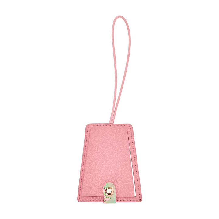 Pink luggage tag with a strap on a white background