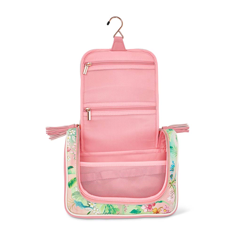 Pink hanging toiletry bag with floral design on a white background