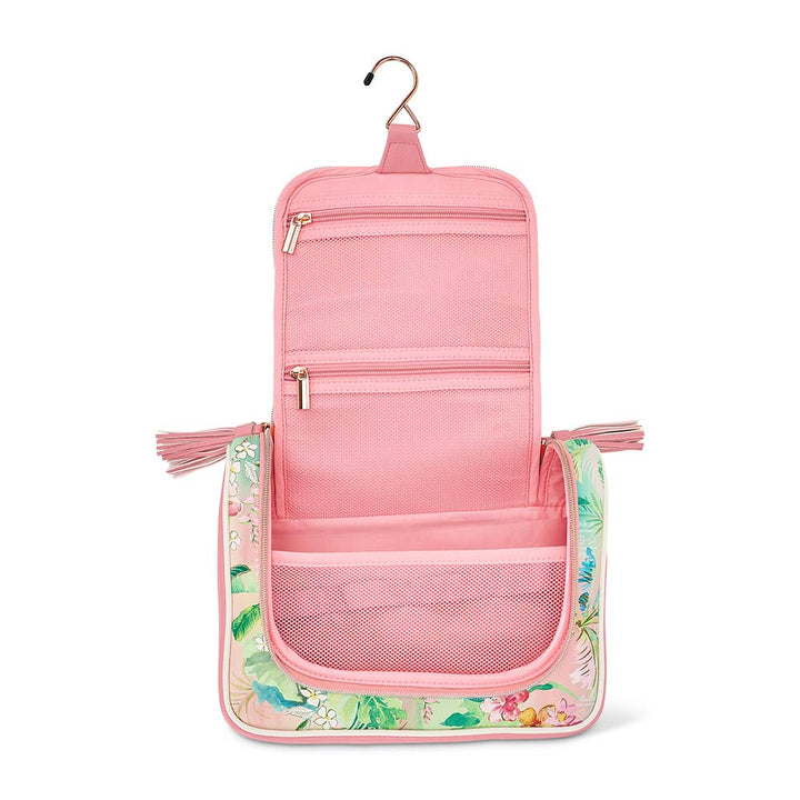 Pink hanging toiletry bag with floral design on a white background