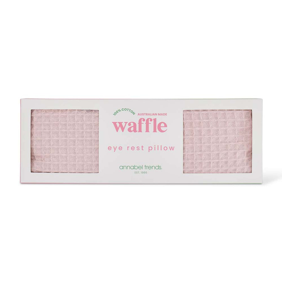 Waffle eye rest pillow packaging with pink waffle pattern on a white background