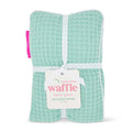 Packaged waffle heat pack with a visible brand label on a white background