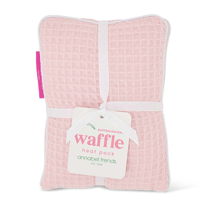 Pink waffle heat pack with a visible brand tag on a white background