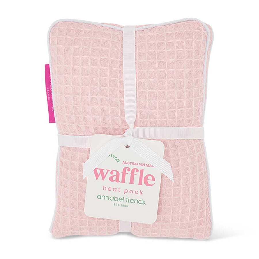 Pink waffle heat pack with a visible brand tag on a white background