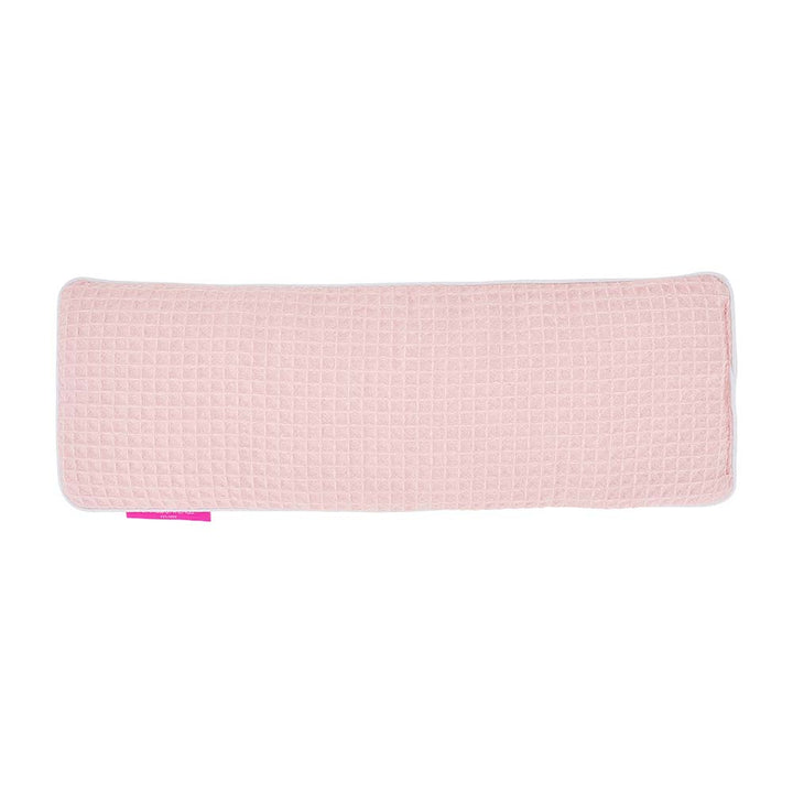 Pink textured heat pack on a white background