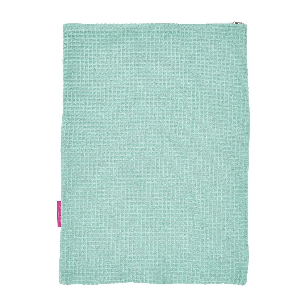 Light blue textured towel with a pink tag on a white background
