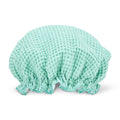 Mint shower cap on a white background