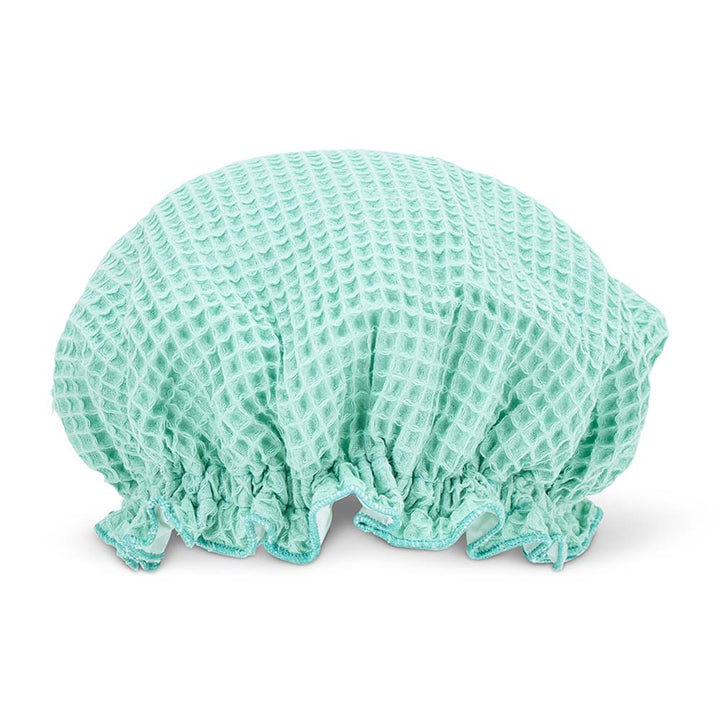 Mint shower cap on a white background