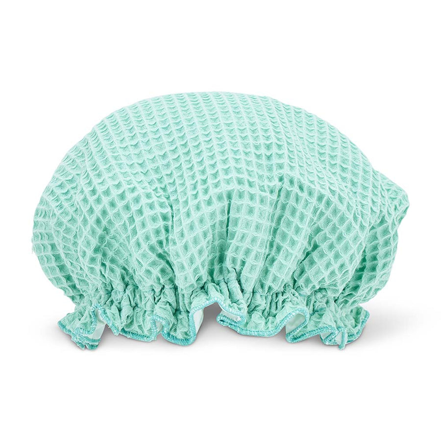 Mint shower cap on a white background