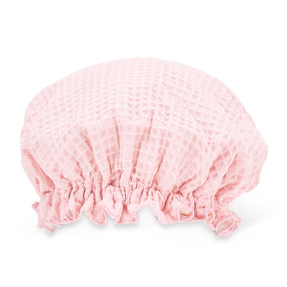 Pink shower cap on a white background