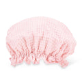 Pink shower cap on a white background