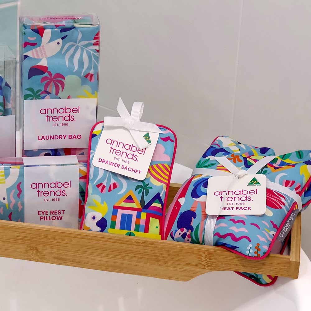 Colorful bath products with 'annabel Trends' branding on a wooden shelf.