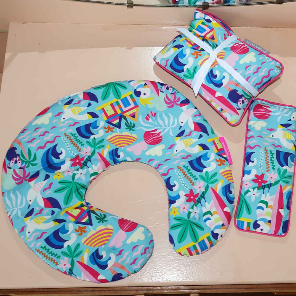 Colorful neck heat pillow with animal pattern on a wooden surface