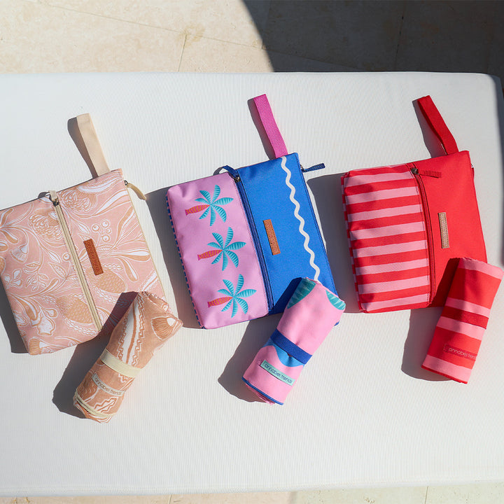 Annabel Trends beach wet pouches and sand free beach towel in trailing natives, red stripe and fiesta designs