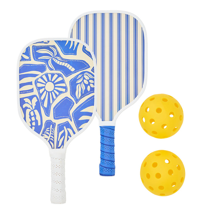 Two pickleball paddles with blue and white patterns and a yellow ball on a white background