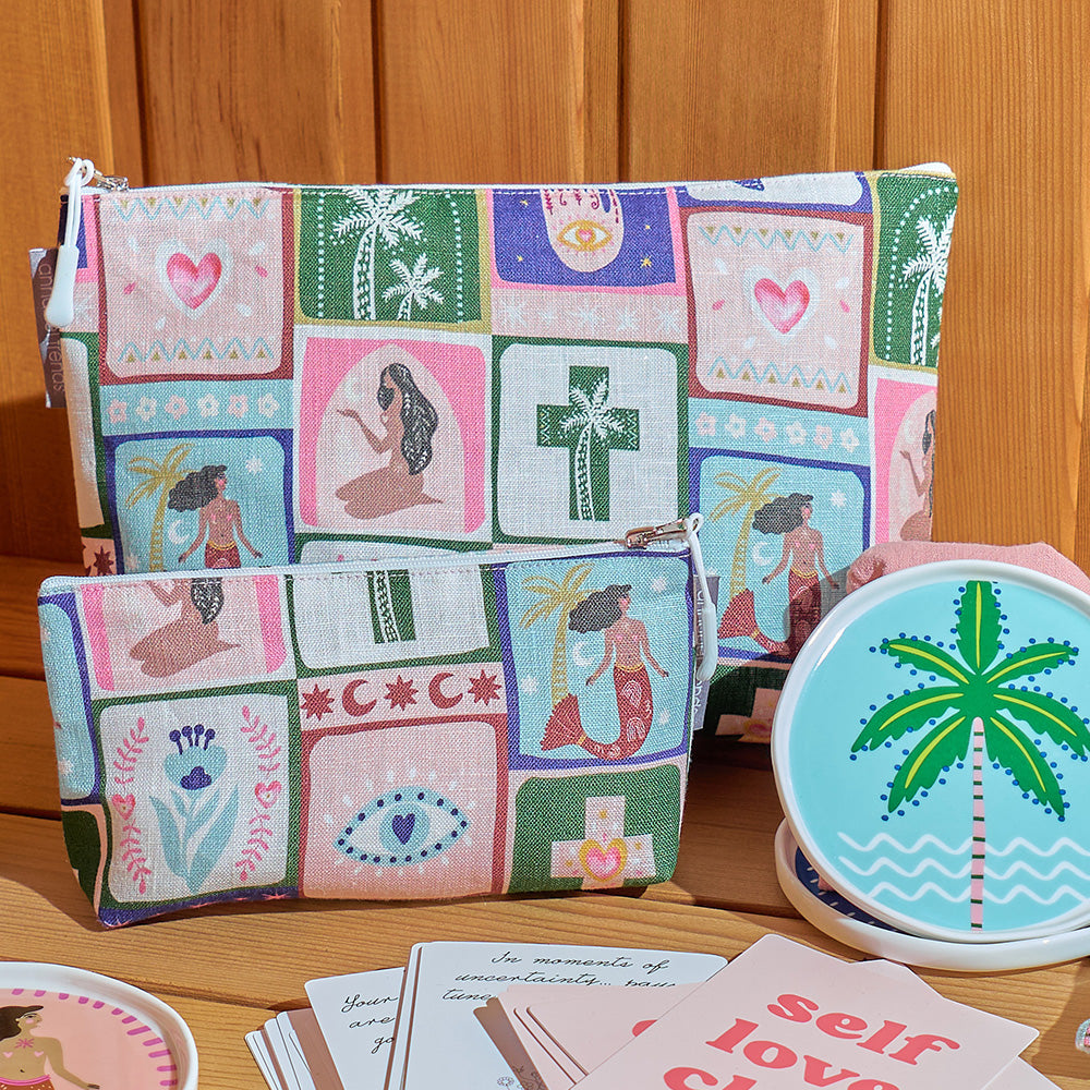 Two colorful pouches with patchwork design on a wooden surface, with a coaster featuring a palm tree design.
