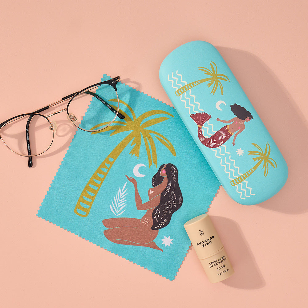 Blue glasses case with tropical celestial dreamsdesign on a pink background