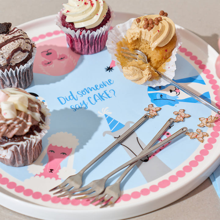 Cupcakes on a plate with cartoon characters and the text 'Did someone say CAKE?'