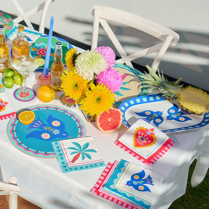 Annabel Trends Fiesta table setting with fiesta serving platter, placemats, coasters, paper napkins