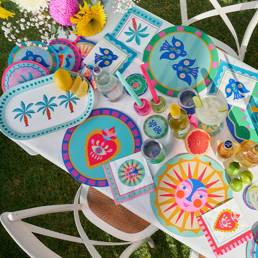 Annabel Trends Fiesta table setting with fiesta serving platter, placemats, coasters, paper napkins