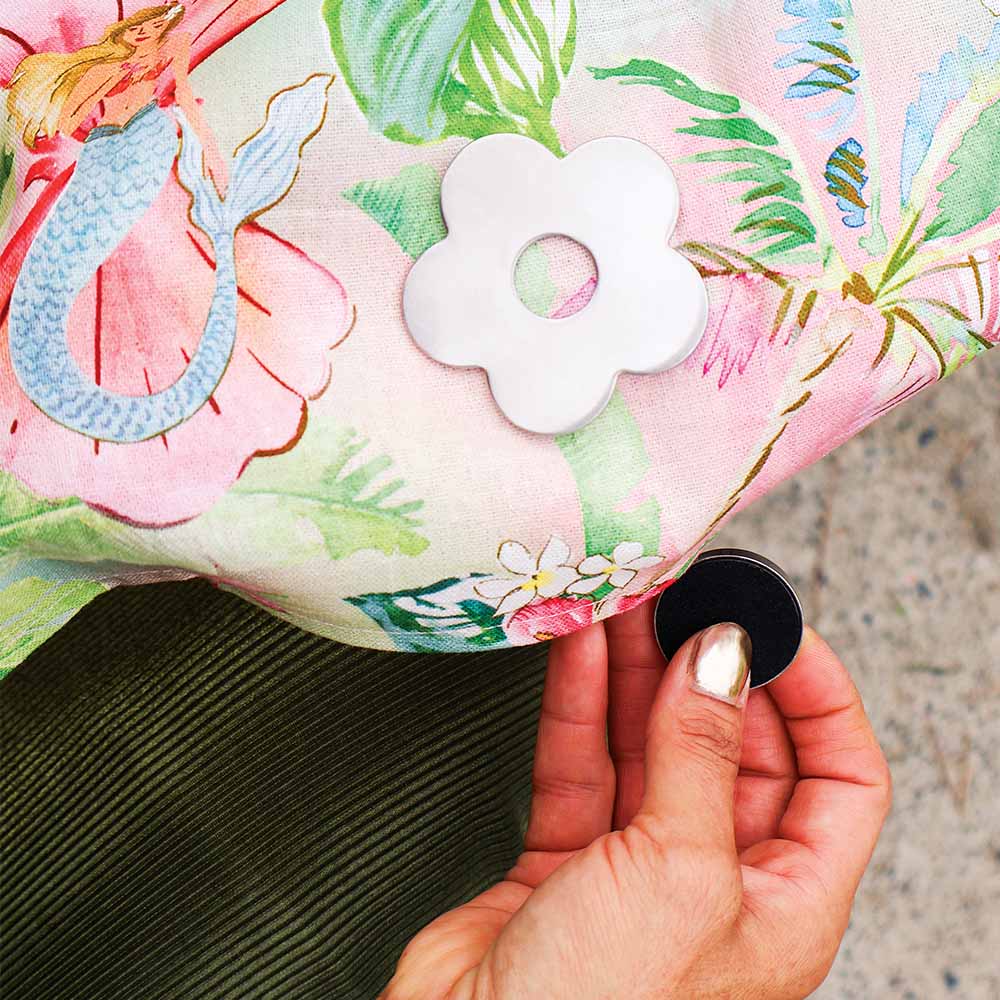 flower shaped tablecloth weight on a floral tiki island tablecloth