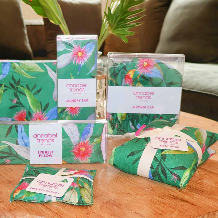 Collection of Annabel Trends products with floral packaging on a wooden surface.