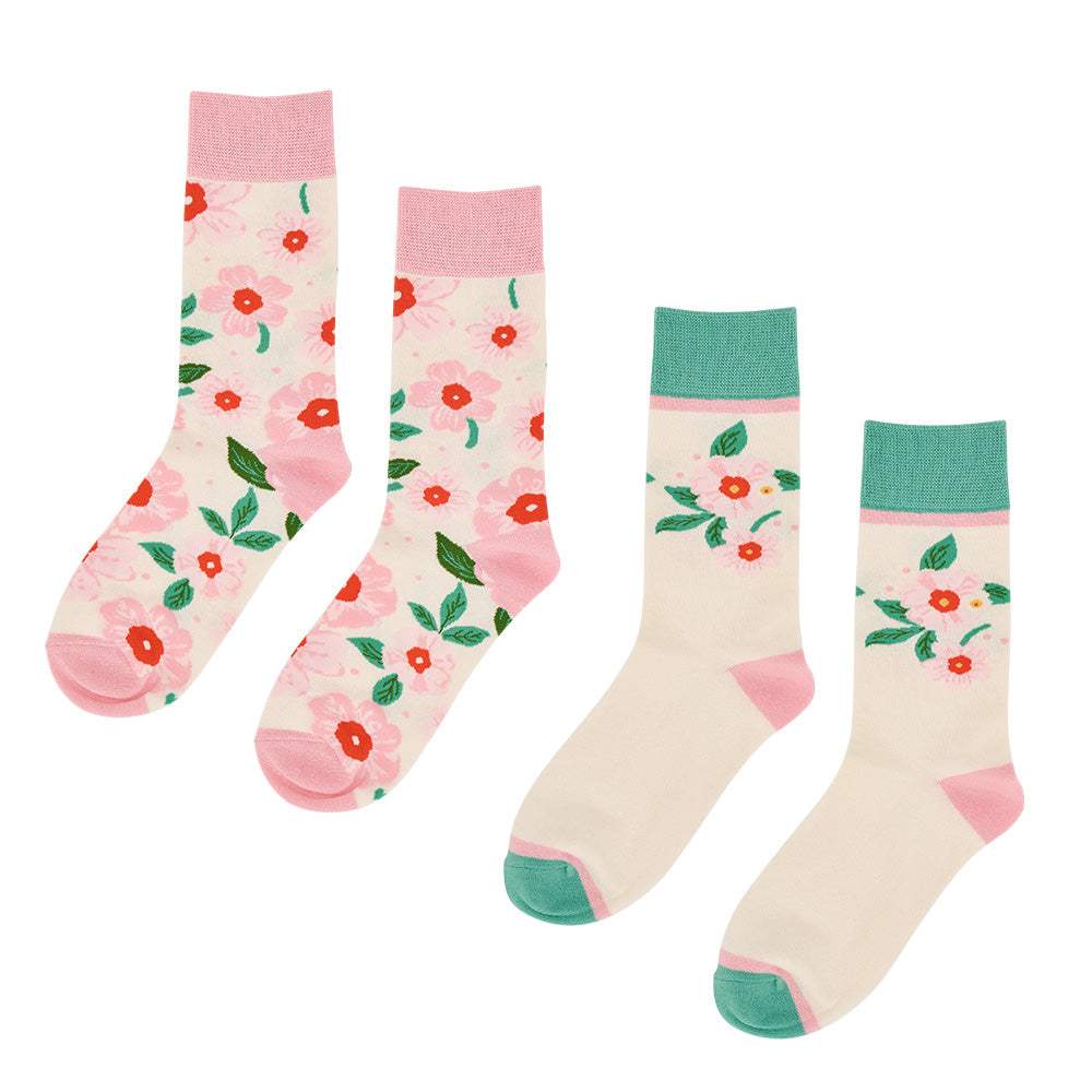 Two pairs of socks with floral patterns on a white background