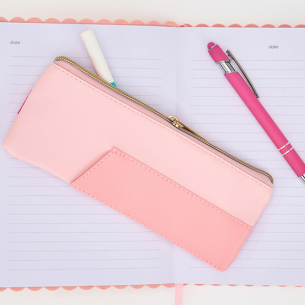 Pink pencil case with a pen on a notebook page