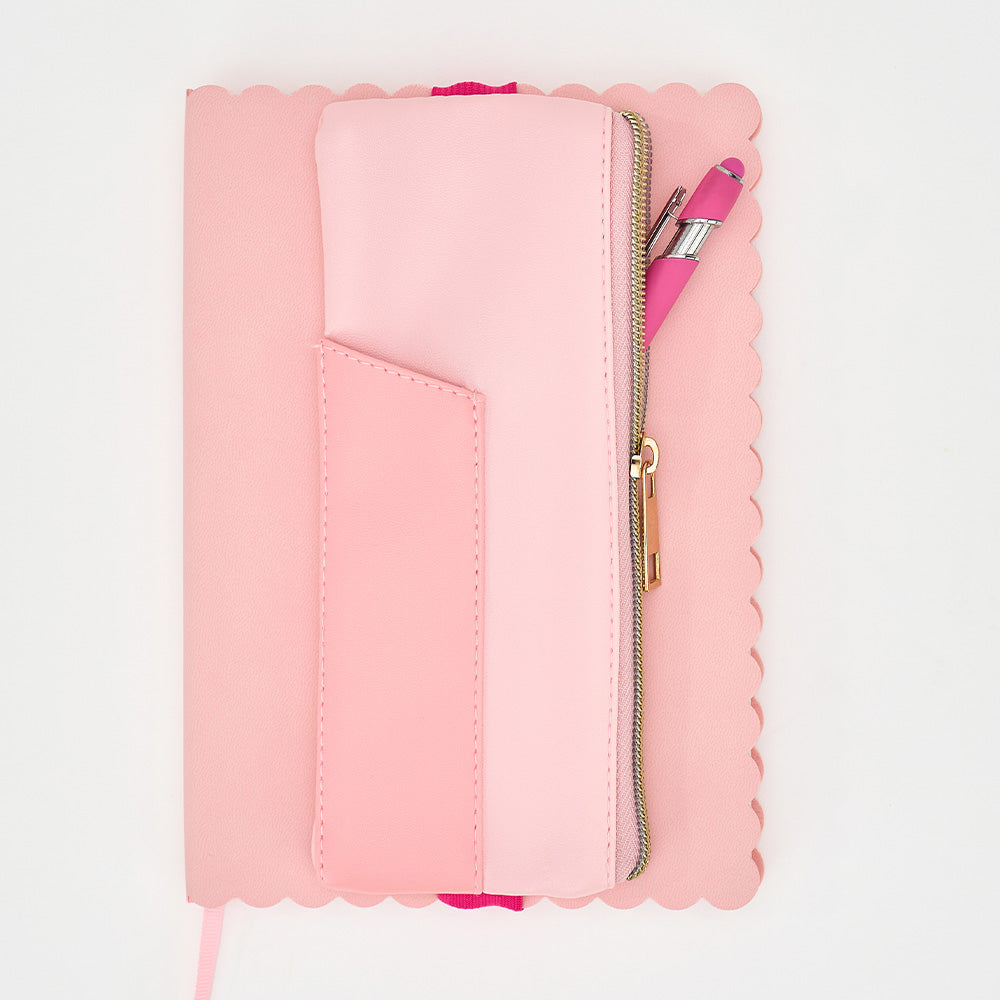 Pink pen pouch with a zipper on a light pink background