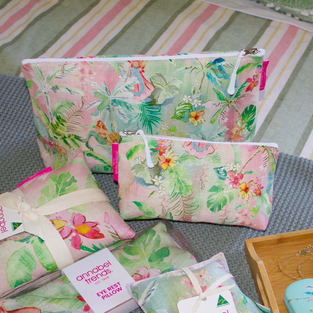 Floral patterned pouches on a striped fabric background