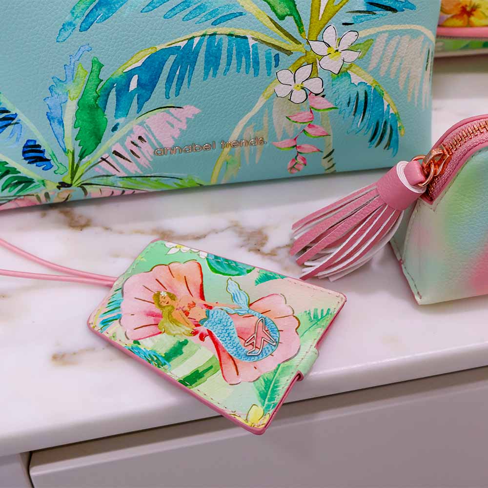 Colorful pouches with floral designs on a marble surface