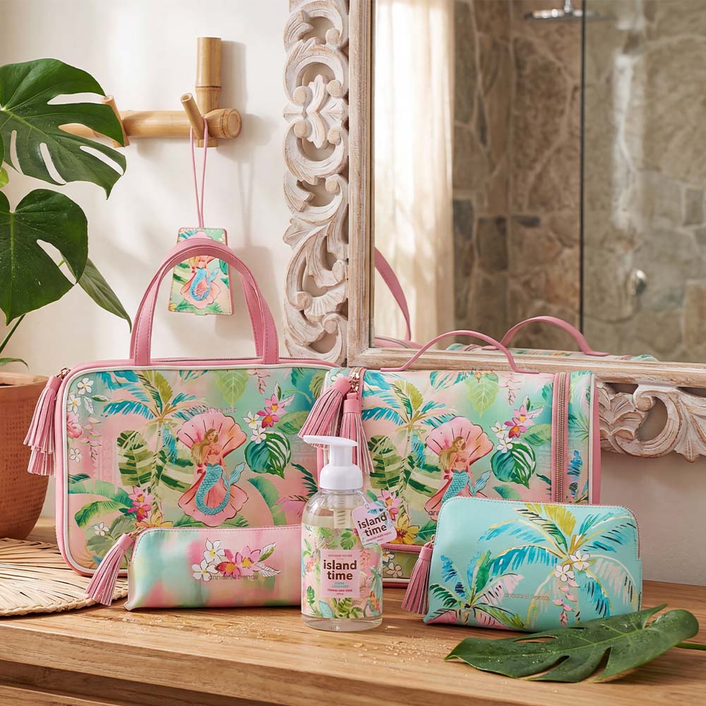 Cosmetic bag set with tropical design on a bathroom counter