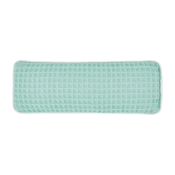 Rectangular green textured eye rest pillow on a white background