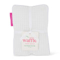 Waffle heat pack with a tag on a white background