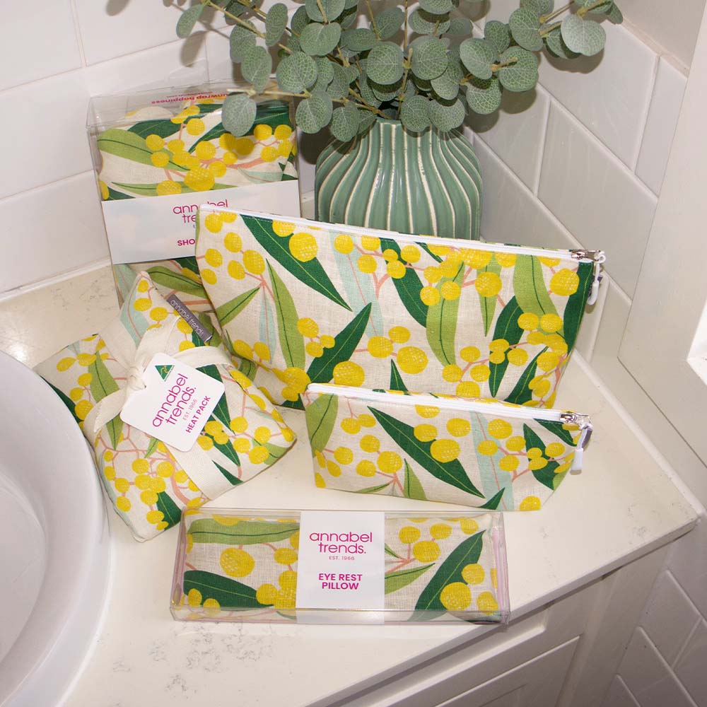 Set of Annabel Trends products with floral design on a bathroom counter.