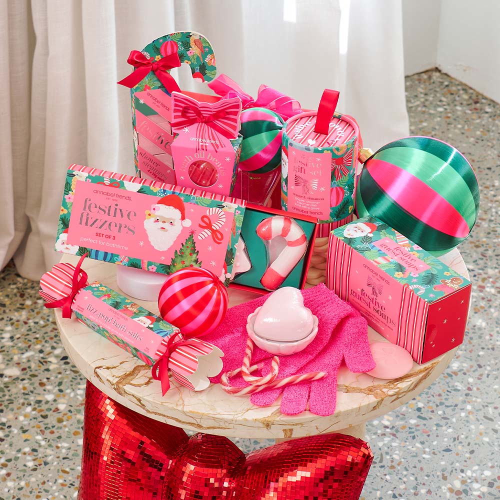 Decorative gift basket with festive items on a table