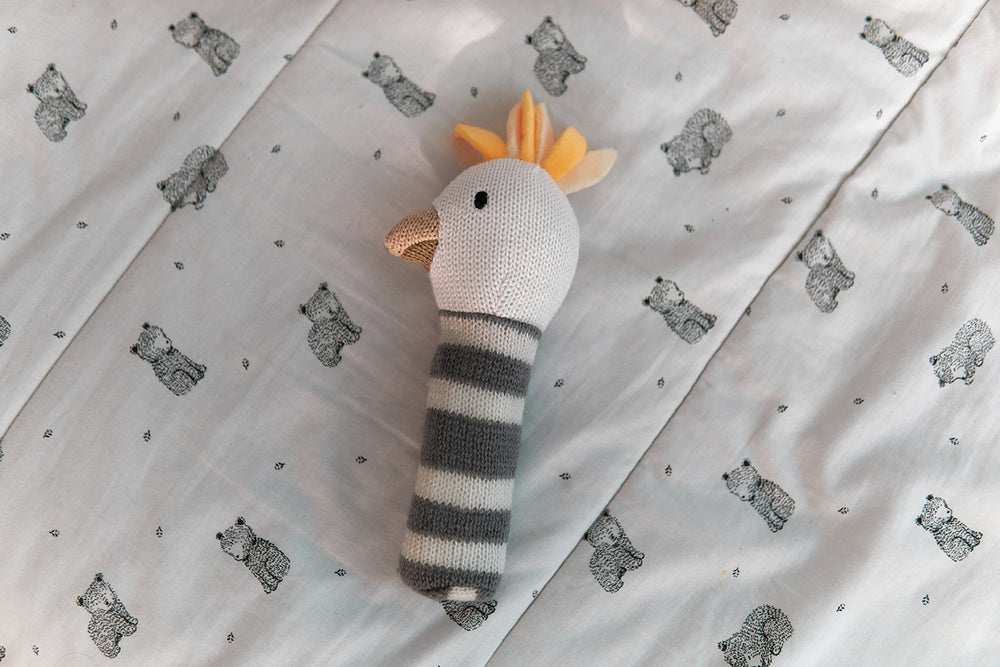 Knitted baby rattle - cockatoo